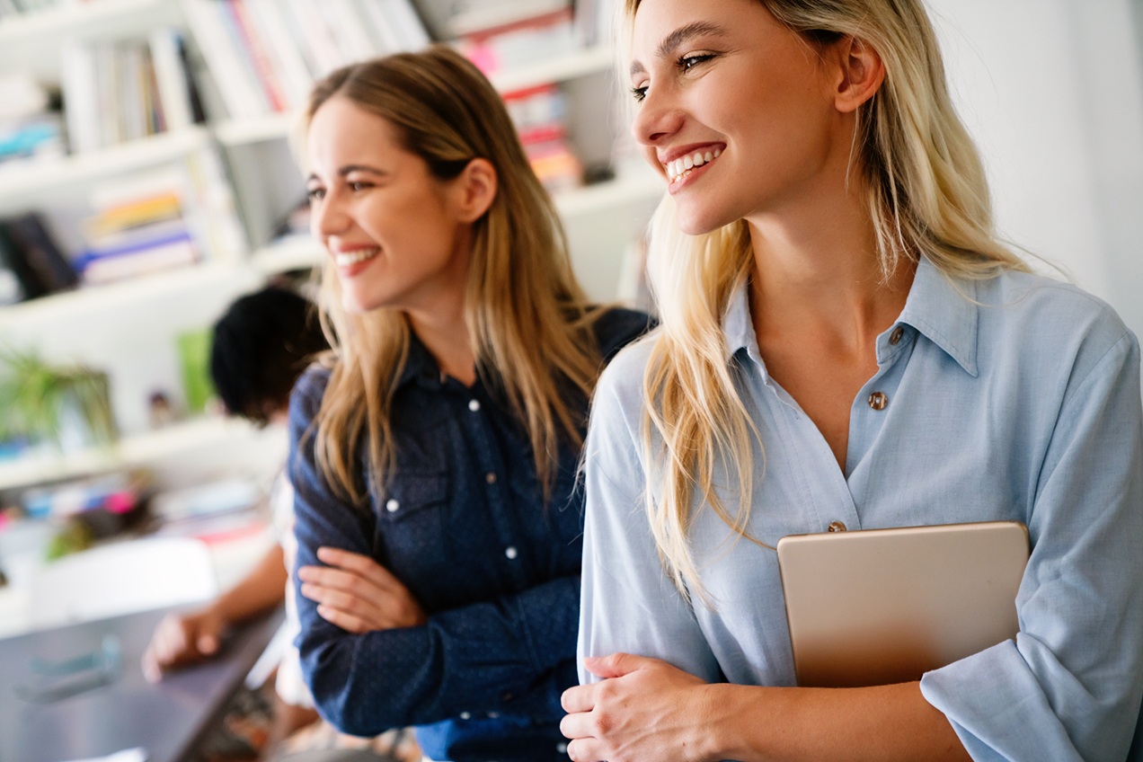 successful young business woman standing in creative modern office. success woman concept.